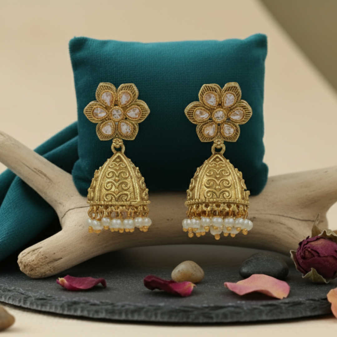 Beautiful White High Quality Golden Polish Jhumkas on an aesthetic backdrop