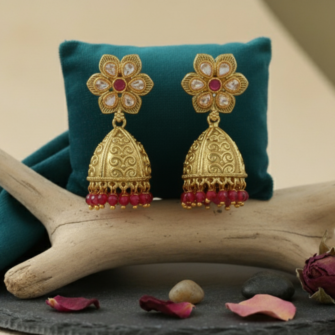 Beautiful Pink High Quality Golden Polish Jhumkas on an aesthetic backdrop