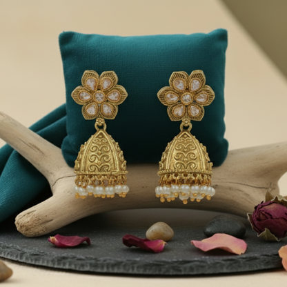 Beautiful White High Quality Golden Polish Jhumkas on an aesthetic backdrop
